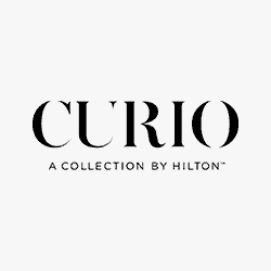 The logo for curio a collection by hilton.
